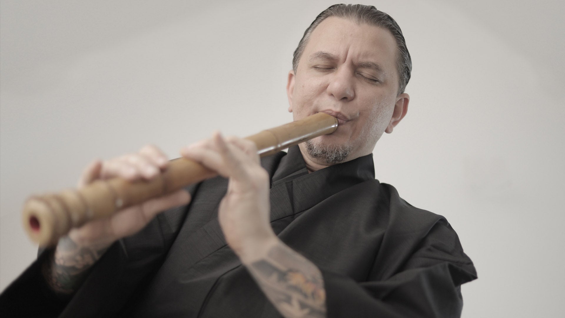 zapata sensei playing a shakuhachi bamboo flute